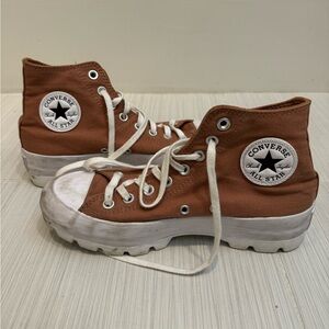 Woman’s brown converse high tops size 8.5